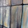 Detail4 Aflutter — cool blue and rust-coloured tiles